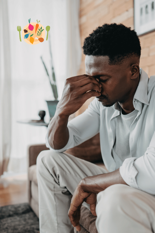 homme de type africain assis et fatigué